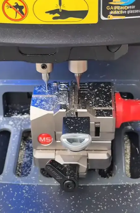 A customer&rsquo;s new key, cut right at the car